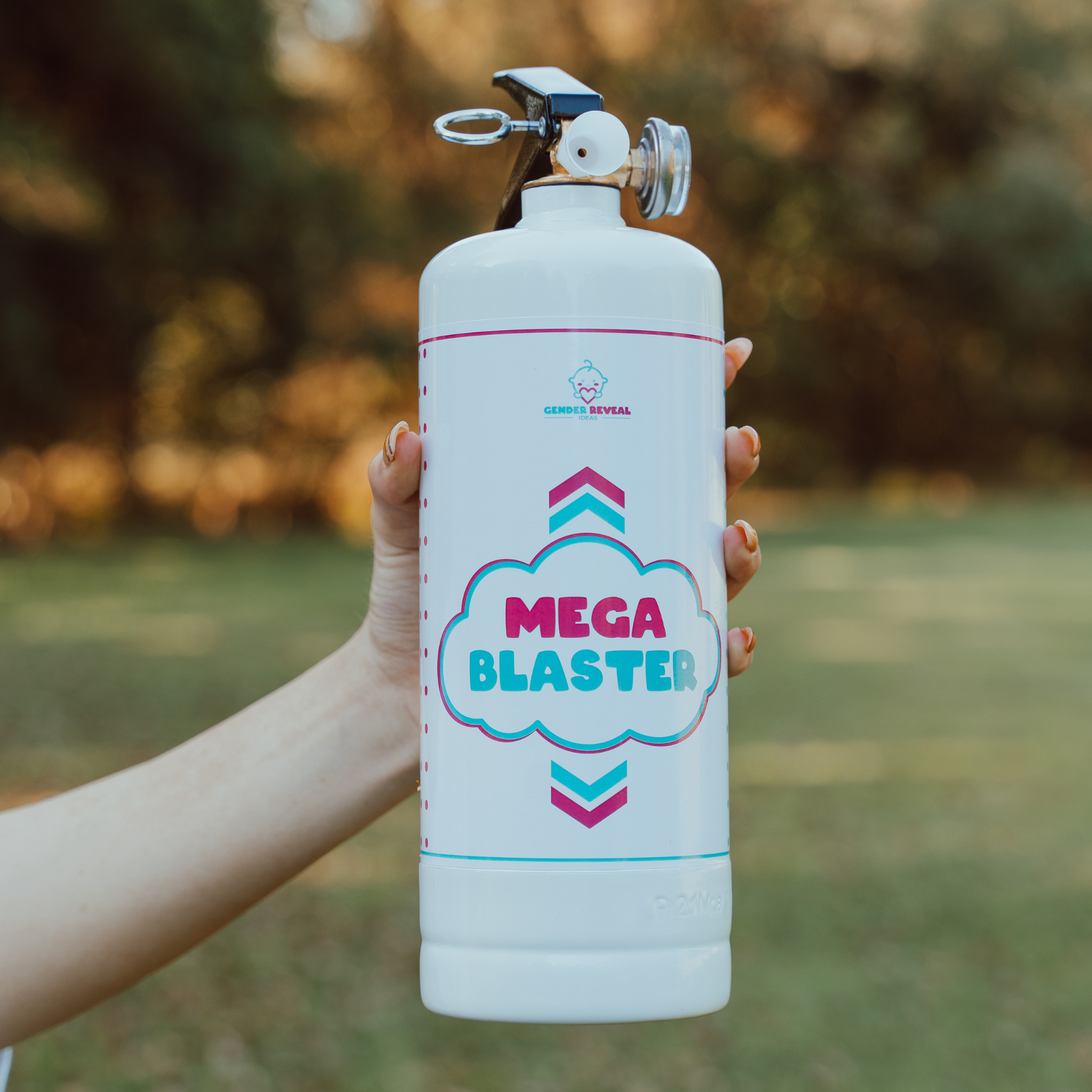 Gender Reveal Double MEGA Powder Blaster displayed outdoors, featuring a white extinguisher-style canister with pink and blue cloud logo design, held against natural blurred background. Professional powder dispenser for dramatic gender reveal celebrations.