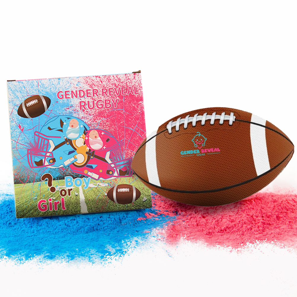 Sports Gender Reveal NFL Ball displayed with product packaging showing cartoon characters and blue and pink powder splashes. Traditional brown football with white stripes and gender reveal logo sits next to colorful announcement card on pink and blue powder background.