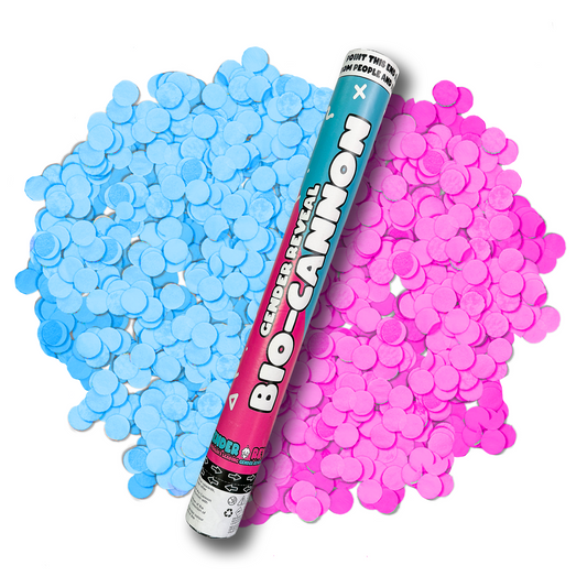 Gender Reveal Confetti Cannon XL 50cm shown with blue and pink paper confetti spread out in piles on either side of the teal and pink metallic cannon tube, demonstrating the festive blast effect for gender reveal celebrations