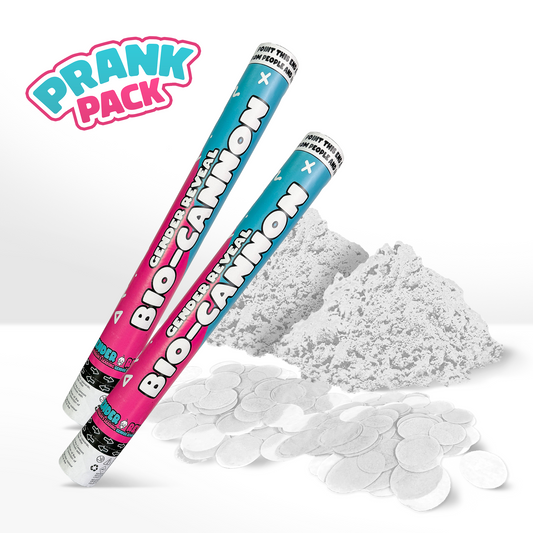 PRANK 2 Pack Gender Reveal Cannon shown with two pink and turquoise striped tubes, alongside white powder and circular confetti pieces scattered below, featuring playful logo design against white background