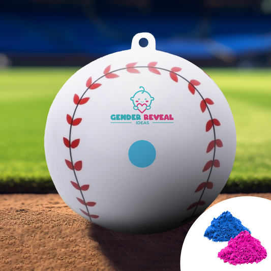 Sports Gender Reveal Baseball displayed on baseball field dirt, featuring classic baseball stitching design in red, blue baby icon logo, and blue center dot, shown with pink and blue powder samples for the reveal moment