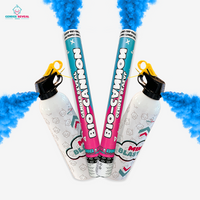 Gender reveal double bundle with two blue bio-cannons and matching extinguishers releasing blue powder smoke