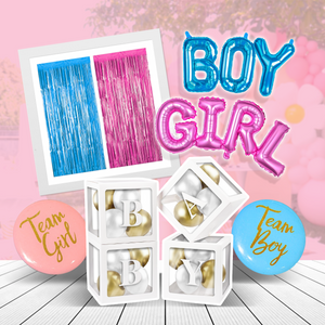 Basic Gender Reveal Decoration Set featuring blue and pink foil curtain backdrop, BOY GIRL balloon letters in metallic colors, white decorative balloon boxes with gold letters, and Team Boy and Team Girl round balloons on wooden surface against pink background.