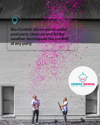 Gender Reveal Confetti Cannon XL 50cm shown in action with bright pink biodegradable confetti bursting against a white brick wall, demonstrating its impressive blast radius while highlighting the eco-friendly nature of the product for gender reveal celebrations.