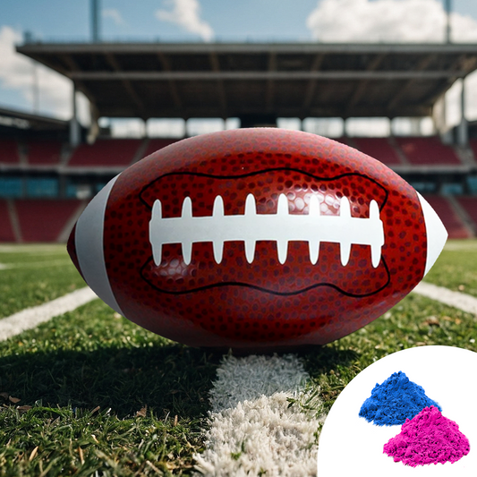 Sports Gender Reveal NFL Ball displayed on football field with stadium backdrop, featuring red football with white laces, alongside blue and pink powder samples for gender reveal celebration