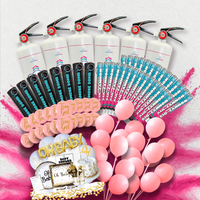 Gender-Geddon Australia's Largest Gender Reveal Bundle featuring multiple smoke powder cannons, decorative party supplies, pink balloons, and gold 'OH BABY' banner arranged on a pink and white background, showcasing a complete gender reveal party package.