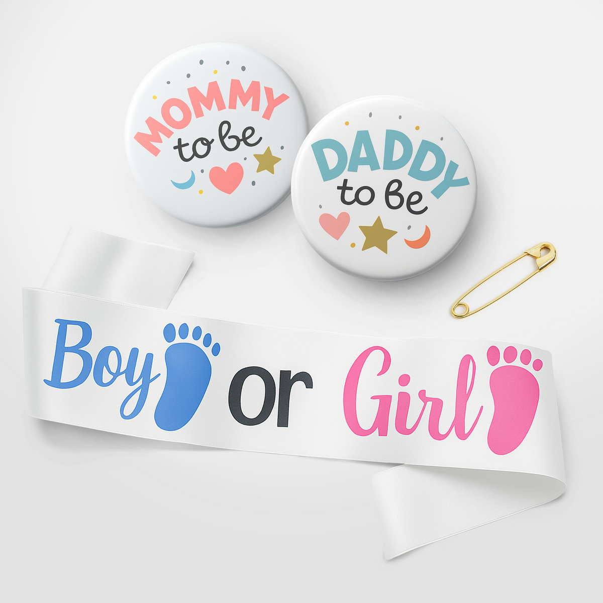 Mum and Dad to be badges and a white ribbon with blue and pink footprints reading Boy or Girl for gender reveal