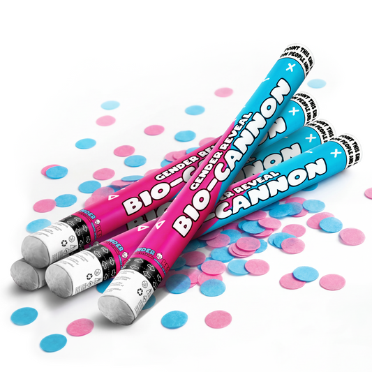 Four biodegradable gender reveal confetti cannons in blue and pink with scattered matching confetti on white background