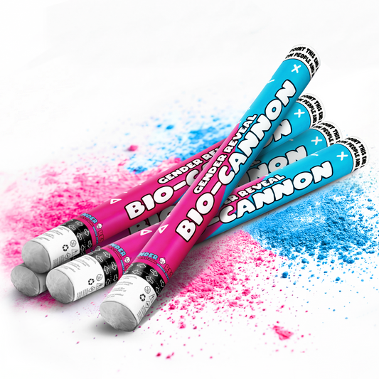 Four gender reveal powder cannons in pink and blue with colored powder spilling around on white background