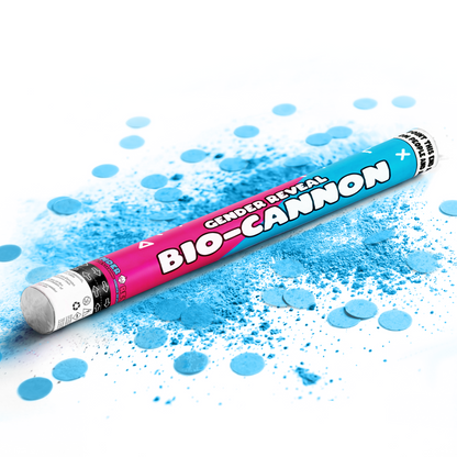Gender reveal bio-cannon lying on blue powder and confetti for gender reveal party celebrations.