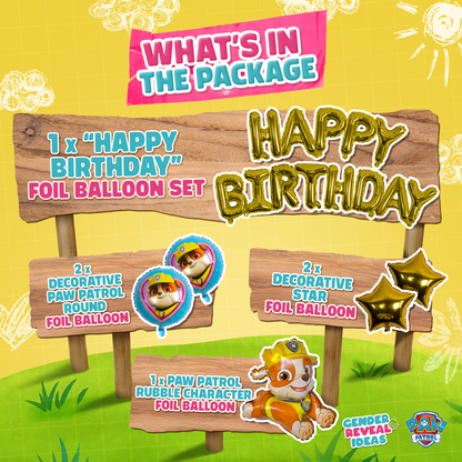 Paw Patrol Birthday Foil Balloon Set featuring gold Happy Birthday letters, Rubble character balloon, decorative star balloons, and themed character foils displayed on wooden signs against yellow background with grass details