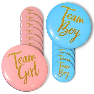 Gender Reveal Party Prediction Badges featuring pink 'Team Girl' and blue 'Team Boy' round buttons with gold lettering, arranged in an overlapping display showing multiple badges from each team in a 20-pack set for gender reveal party celebrations.